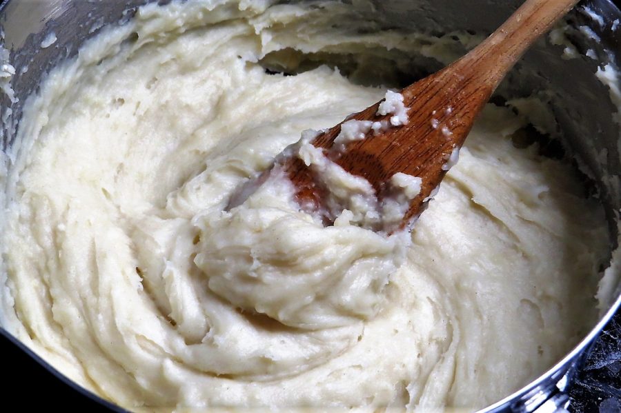 Stirring churro dough Stirring churro dough